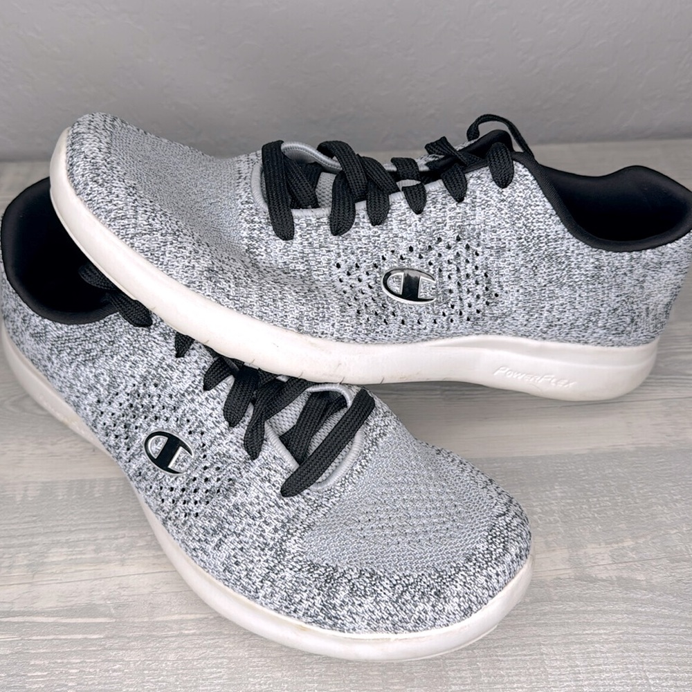Stylish grey and black athletic sneakers. Perfect for casual wear or workouts.